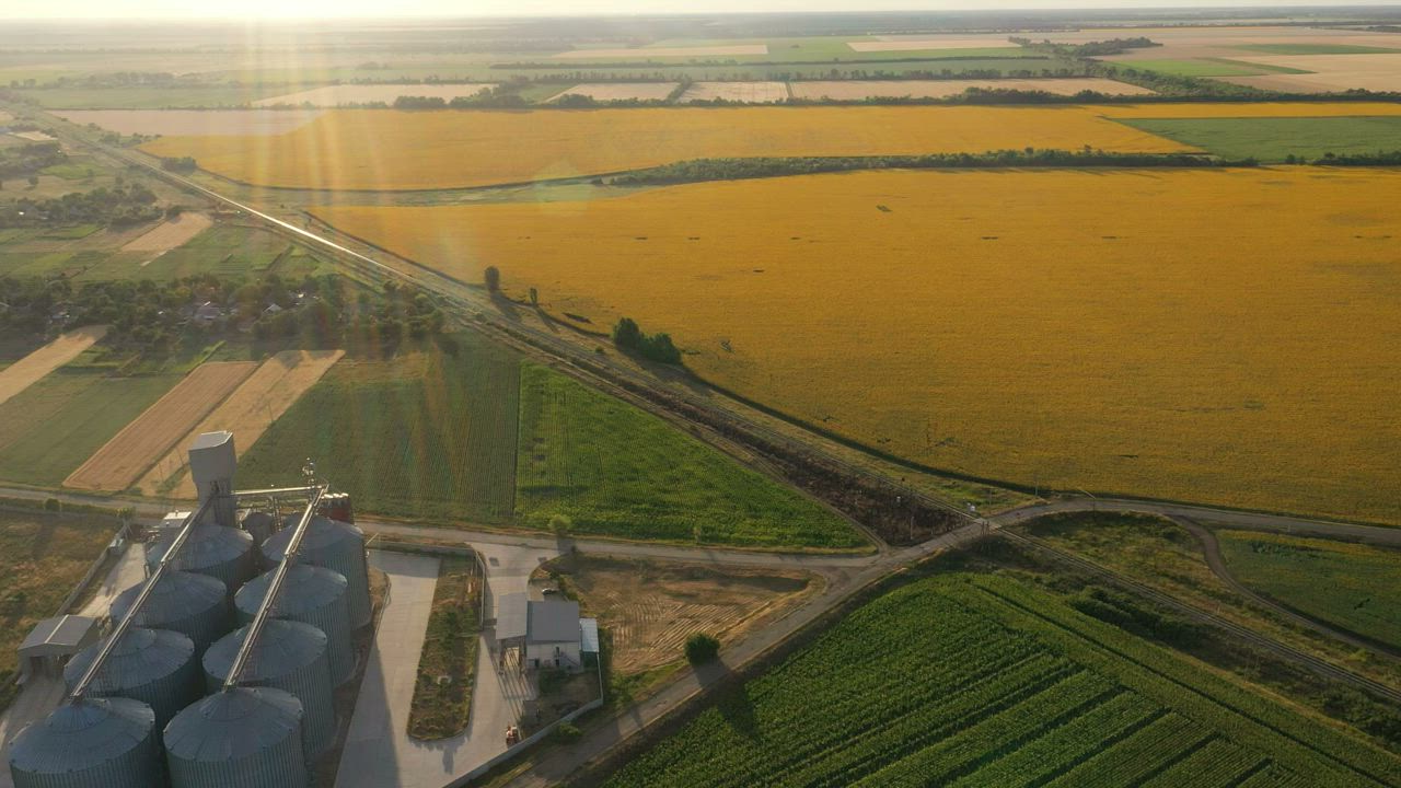 Aerial view of bulk storage silos at golden hour